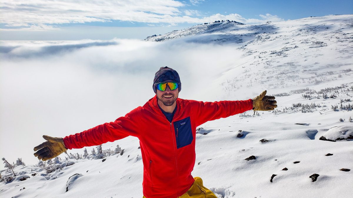 Aaron above the clouds literally in the Skida Nordic Hat